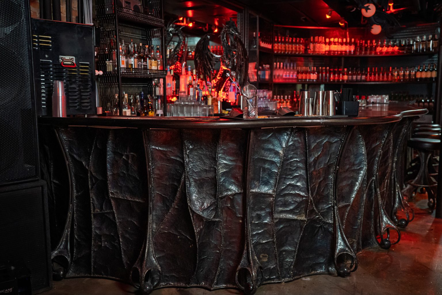 The Lair Chicago claw-leg bar and dragon sculpture