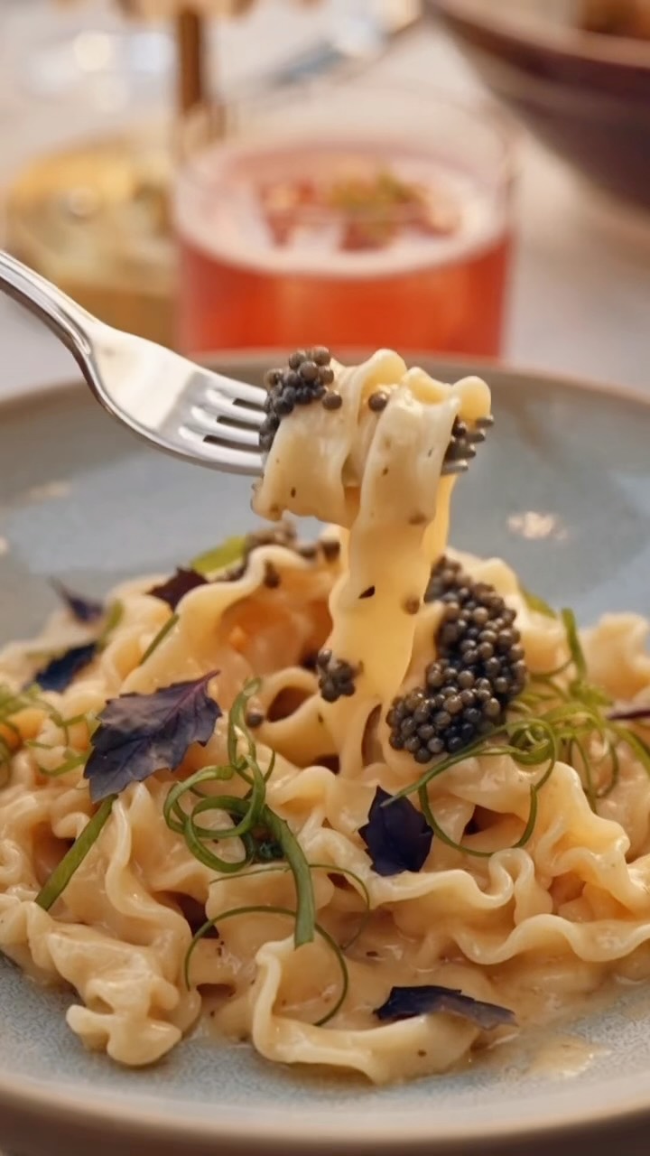 Arla Chicago yuzu caviar mafaldine pasta lifted on a fork