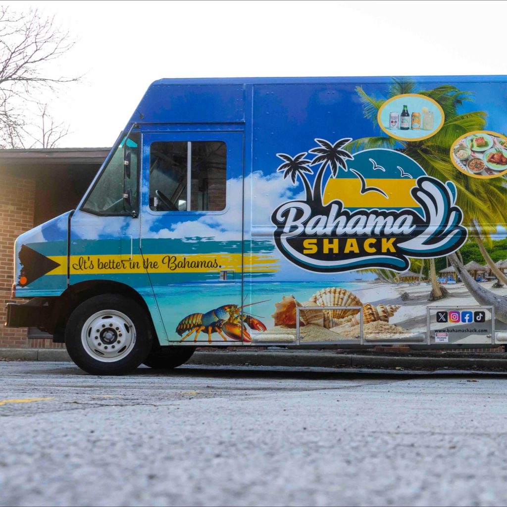 Bahama Shack Chicago food truck wrap with tropical beach graphics parked for Hyde Park debut