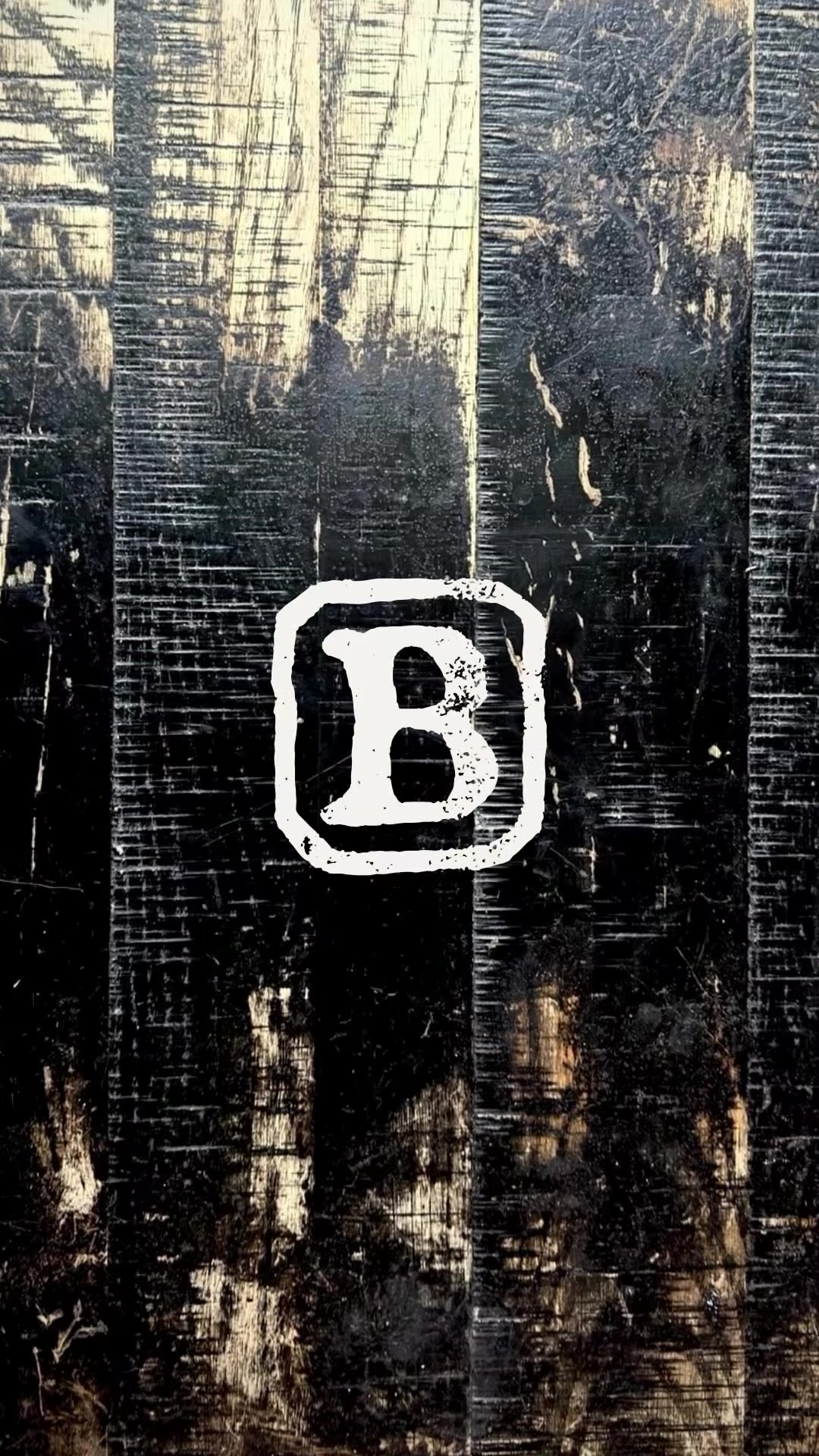 Black Briar Chicago B logo stamped on charred wood