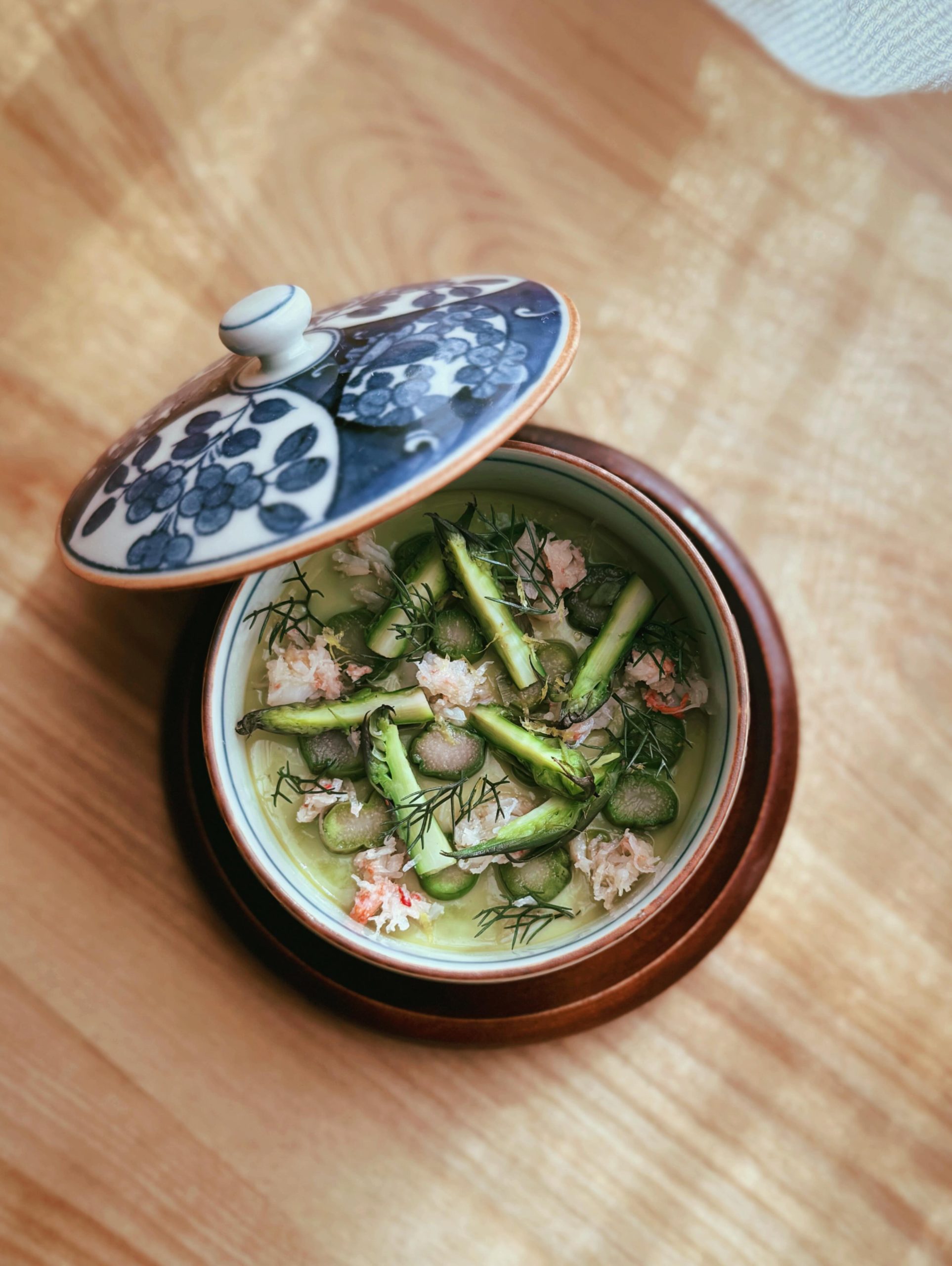 Kumiko Chicago green garlic chawanmushi with crab and asparagus in a floral ceramic bowl