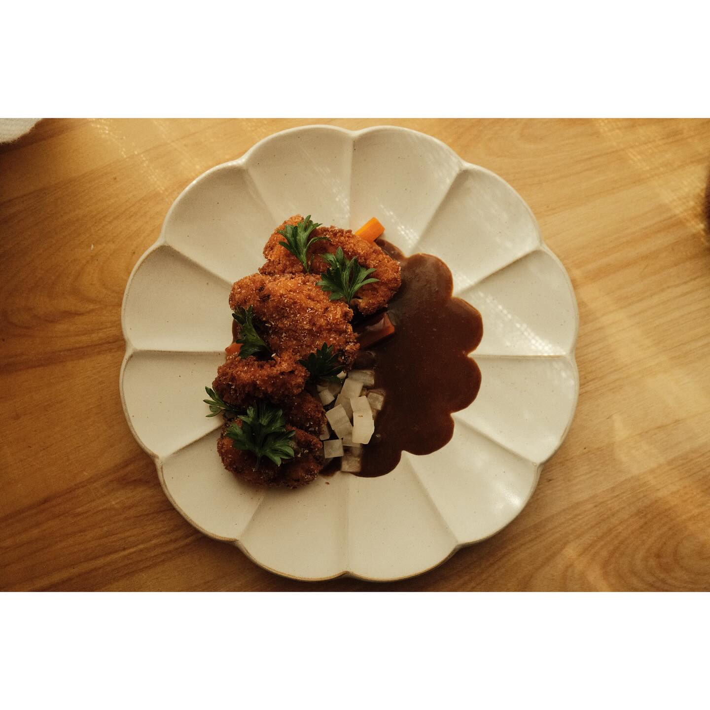 Kumiko Chicago sweetbread katsukarē with house curry on a scalloped ceramic plate