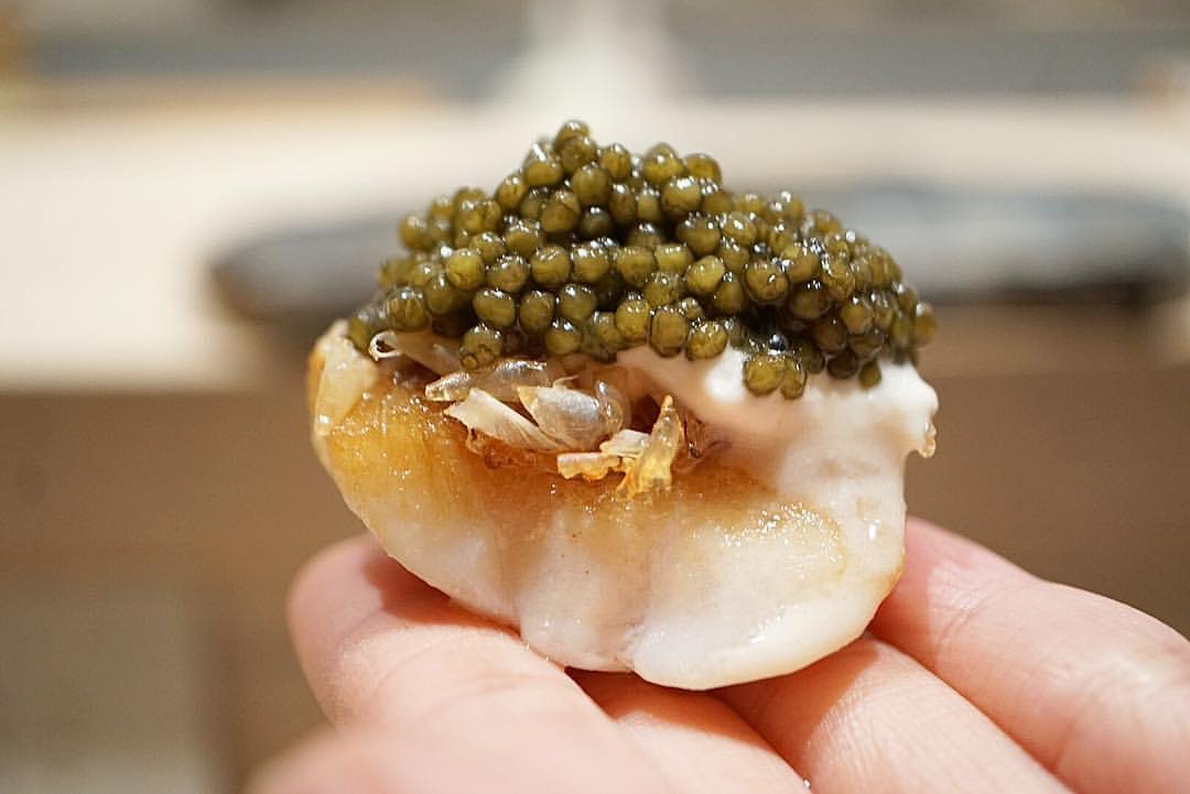 Kyōten Chicago amadai with crème fraîche and caviar held at the sushi counter