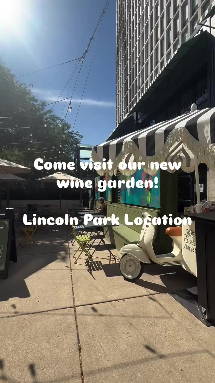 Piccadilly Market Lincoln Park Piccadilly Square outdoor courtyard wine garden with scooter and striped awning