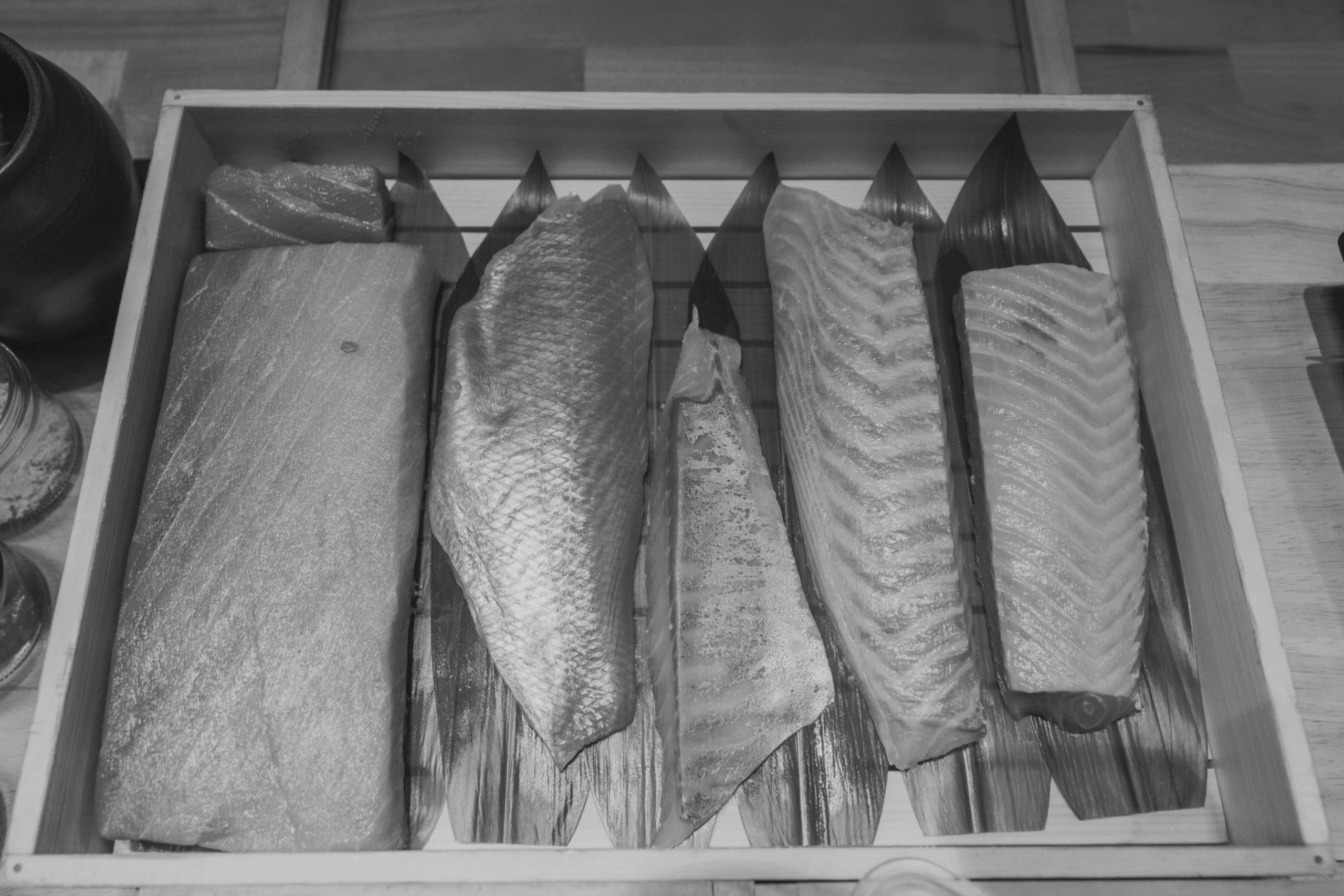 Sushi by Scratch Chicago wooden fish box with sushi-grade fillets ready for omakase