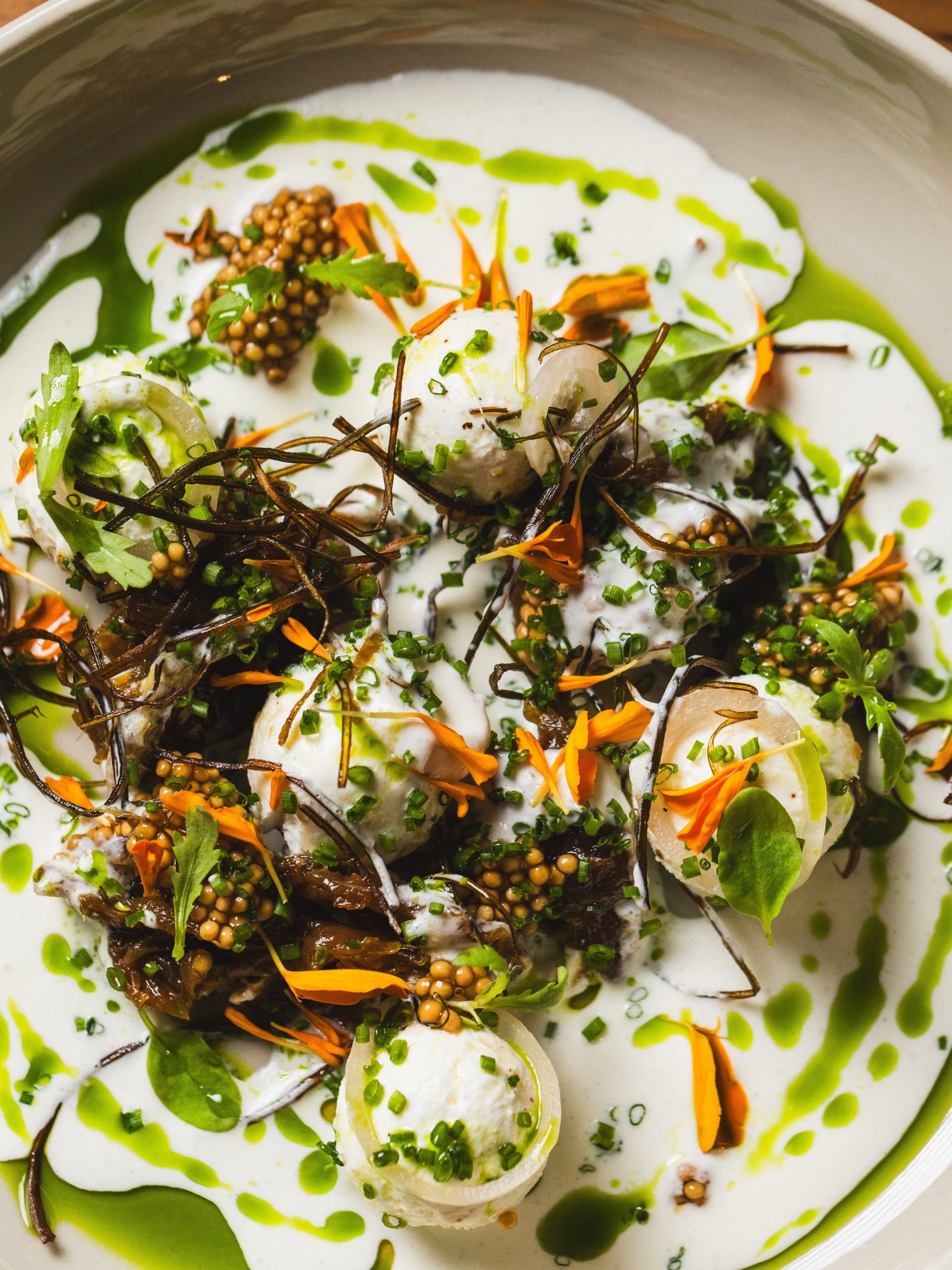 Susu Chicago labneh mezze plate with herb oil and edible flowers