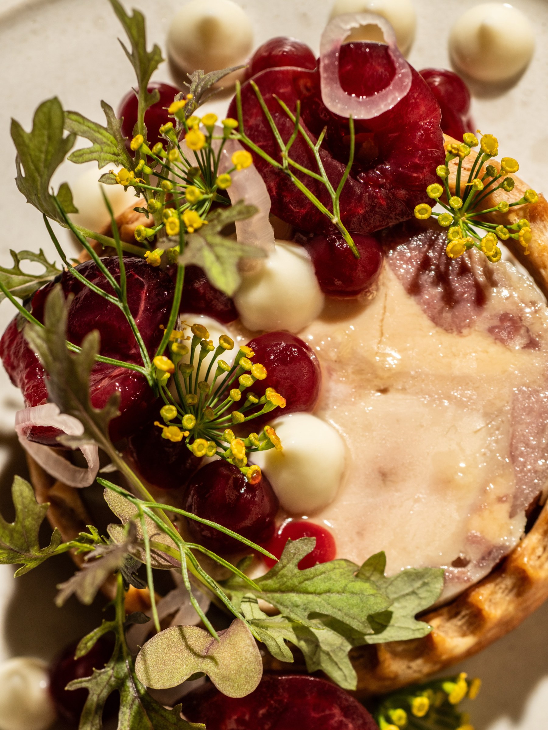 Foie terrine en croute with cherries, flowers and herbs at All Well Chicago