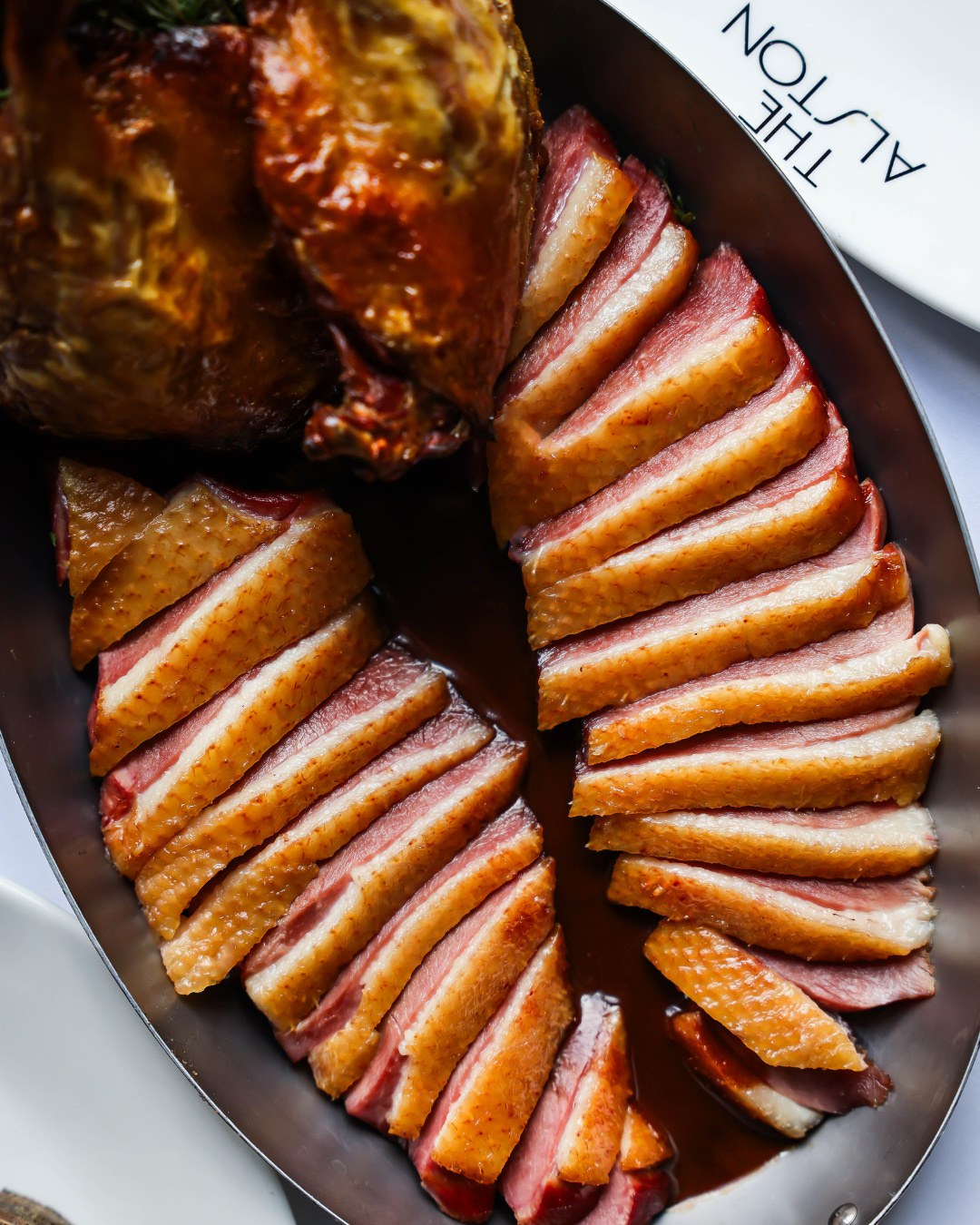 Duck a la Presse carved tableside at The Alston Chicago