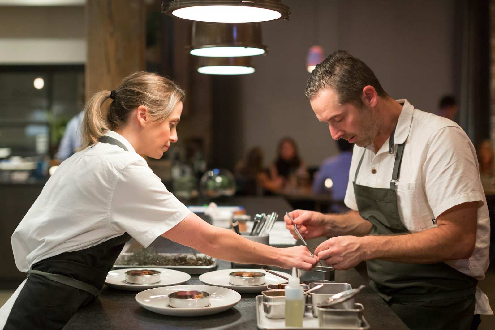 Smyth Chicago chefs plating a course in the kitchen