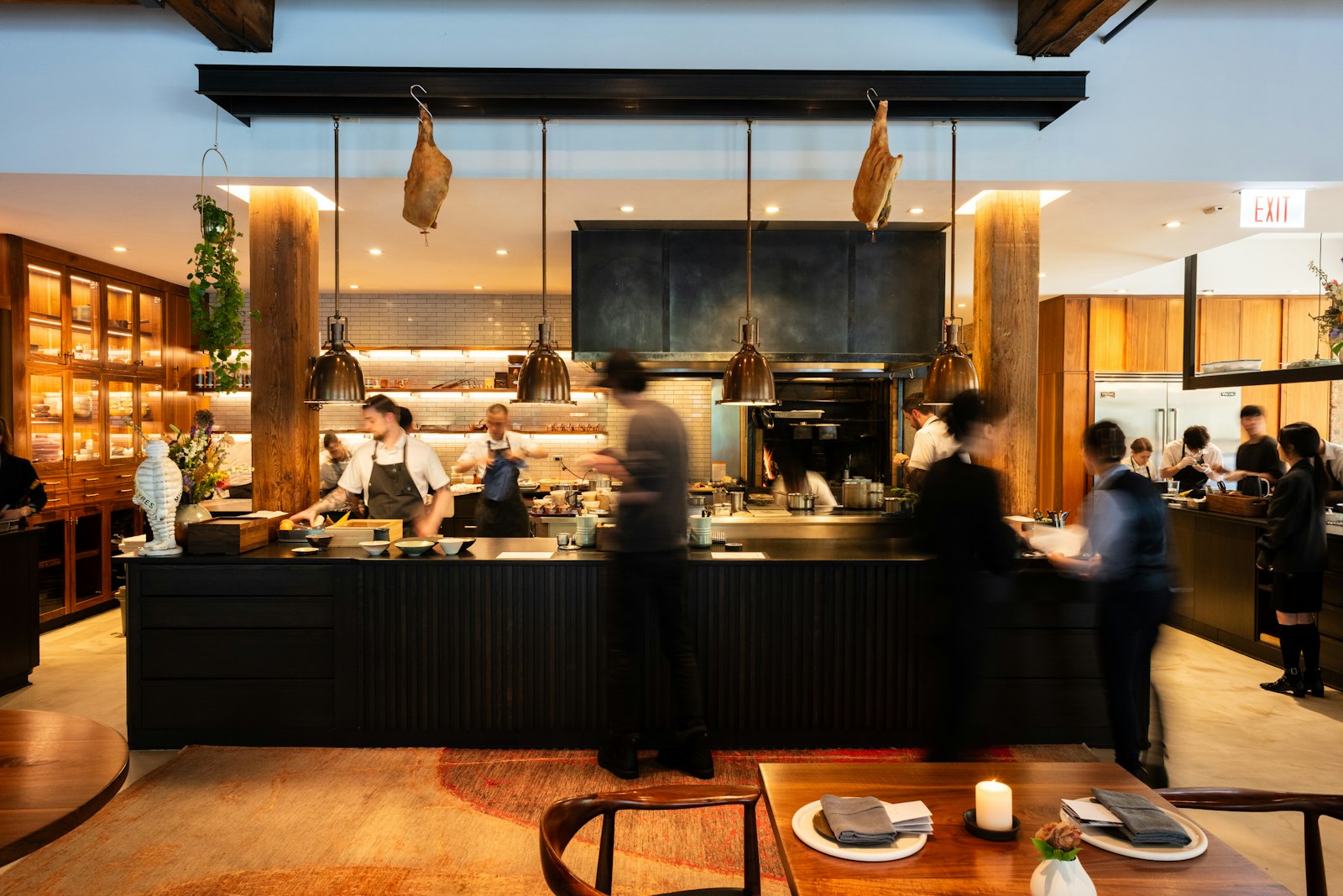 Smyth Chicago open kitchen with chefs working the pass beside the dining room