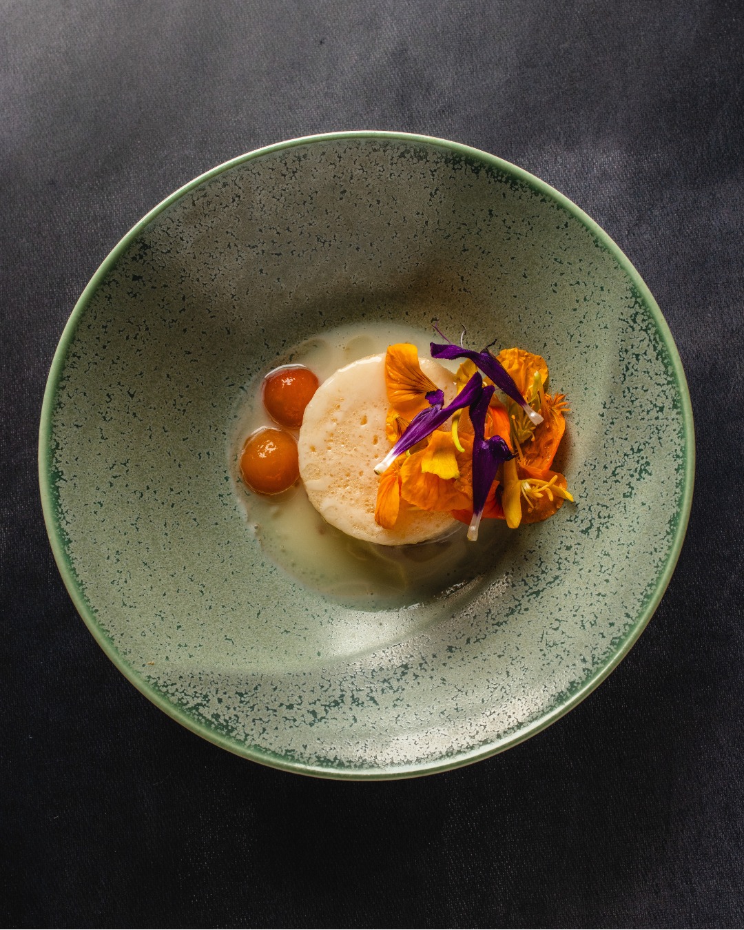 Smyth Chicago Sungold tomato course with tomato sponge, tamarillo puree and soy milk glaze