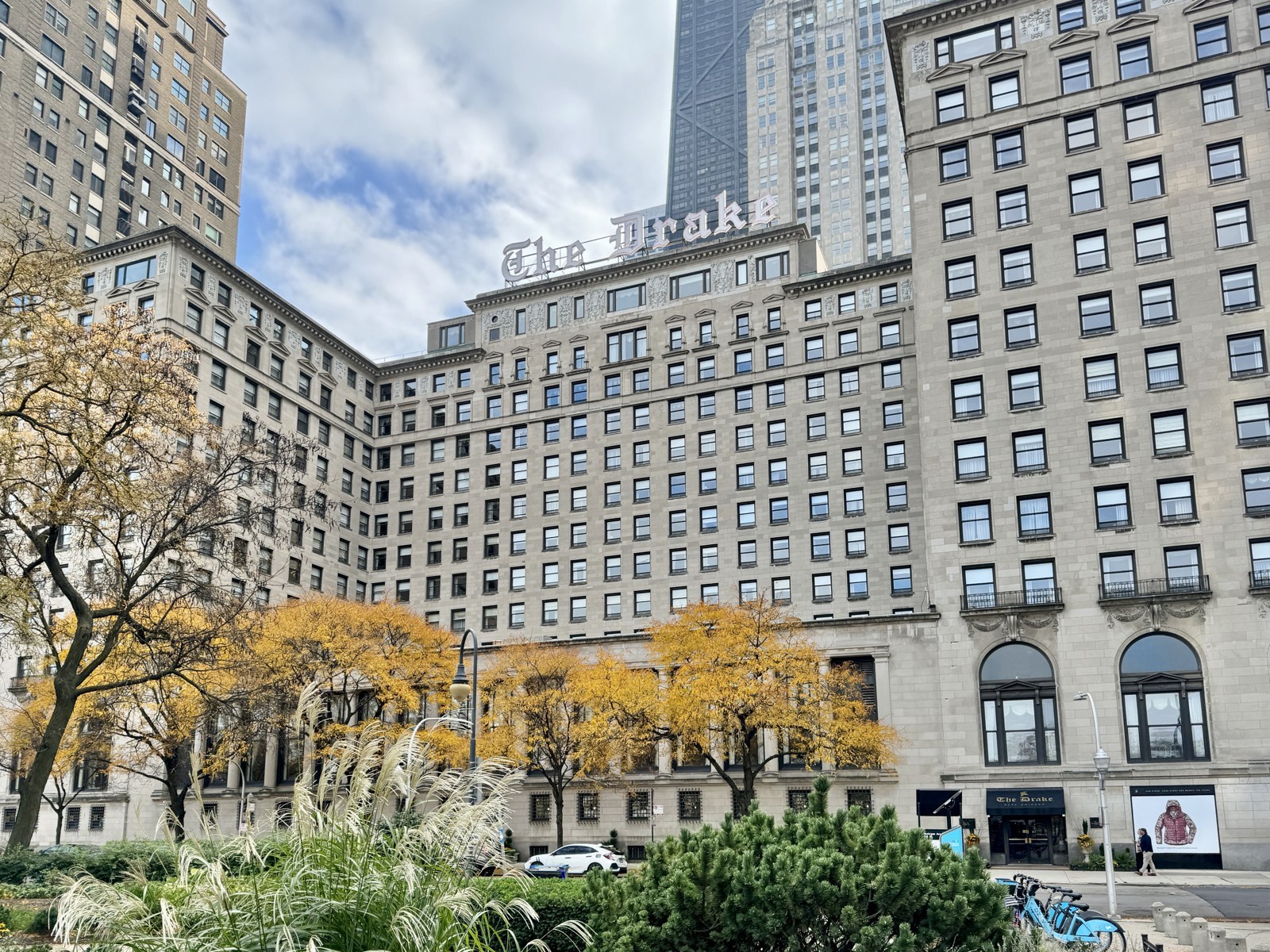The Drake hotel sign above autumn trees on Michigan Avenue in Chicago
